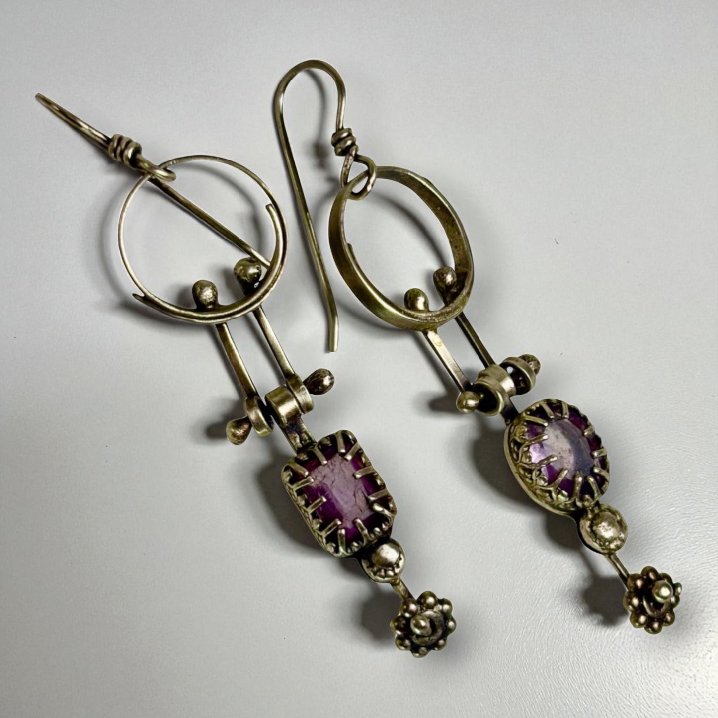 Swinging amethyst dangles